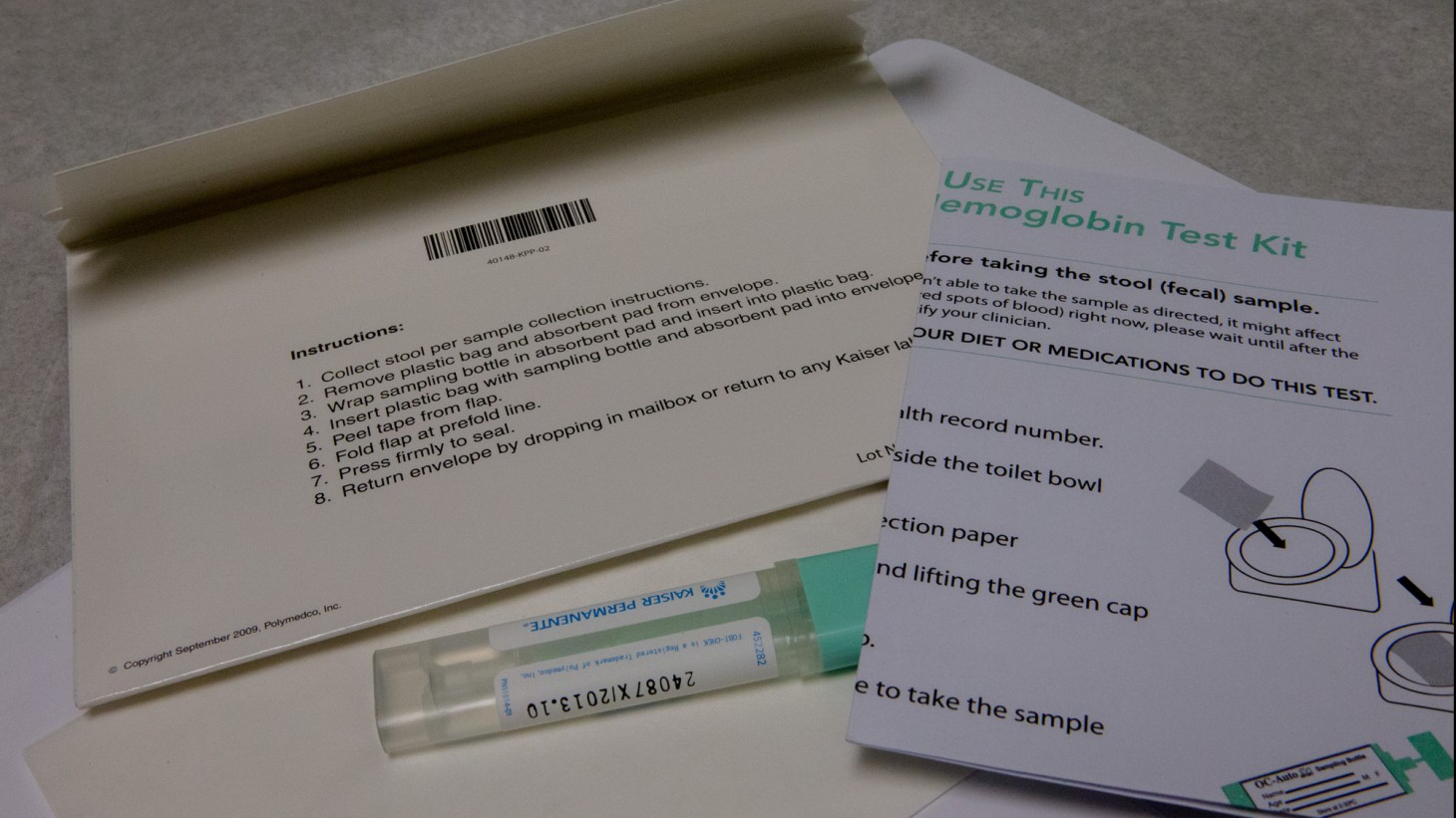 Envelope, test tube and instructions for a FIT kit