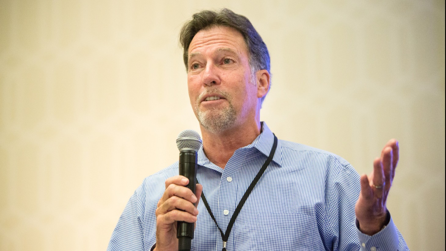 Walter Allen speaking into a microphone