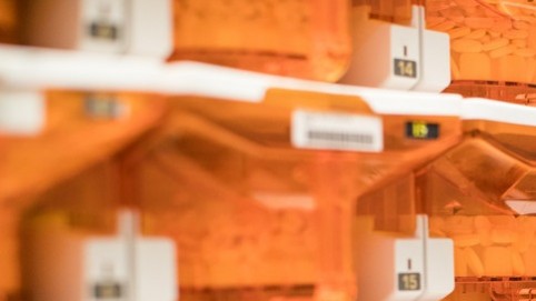 orange bins filled with pills