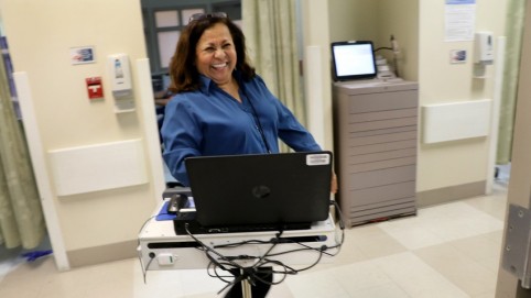woman with computer on wheels